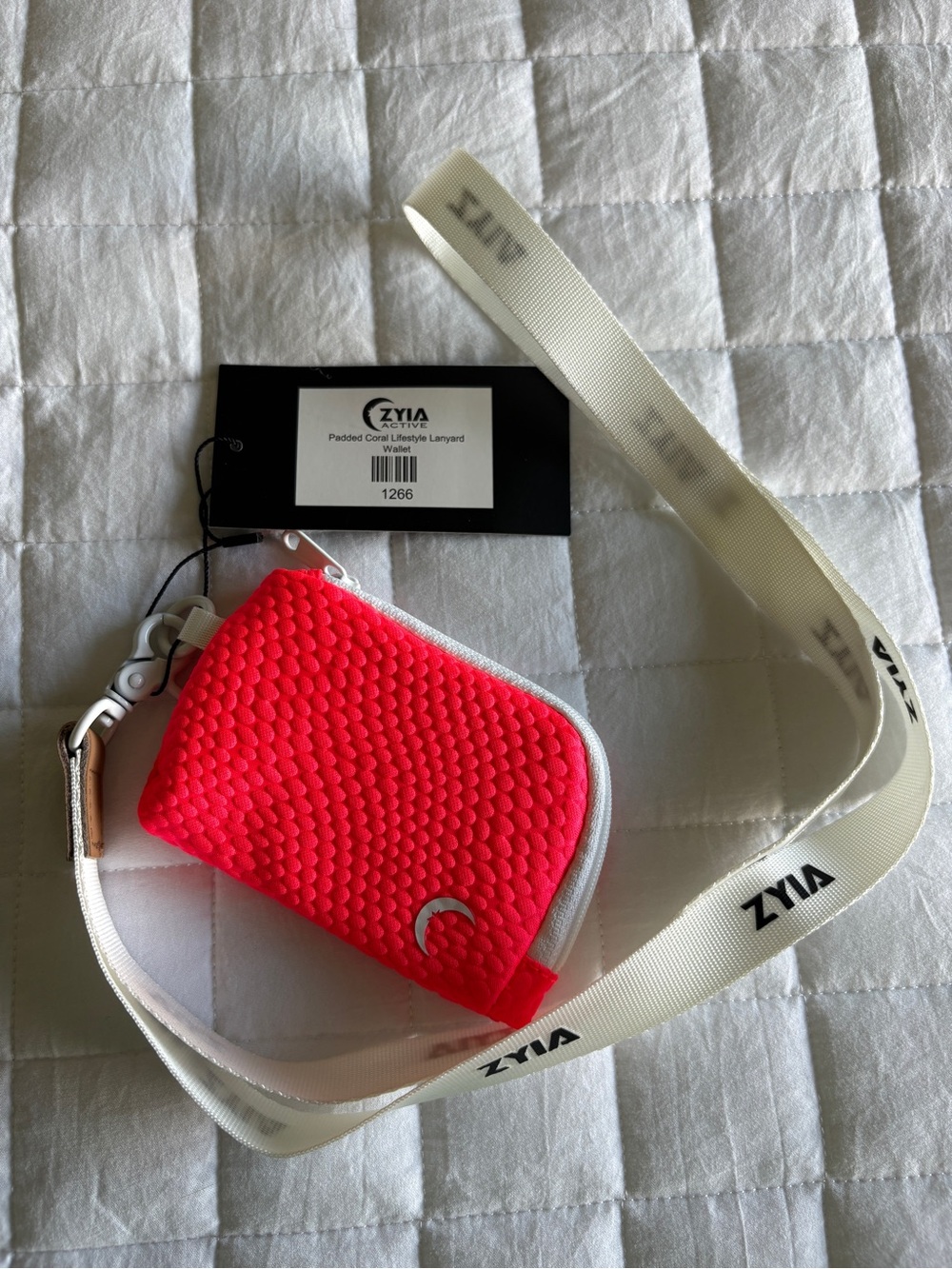 ZYIA Bright Coral Textured Pouch with White Branded Lanyard